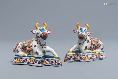 A pair of polychrome Dutch Delft models of recumbent cows, 18th C.