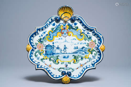 A large polcyhrome Dutch Delft plaque with a couple near a river, 18th C.