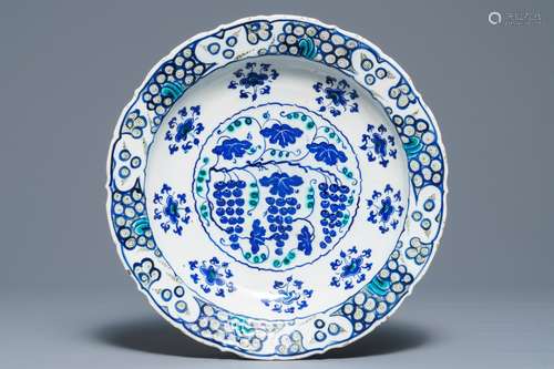 An Iznik 'grapevine' dish in blue and green, Turkey, 3rd quarter 16th C.