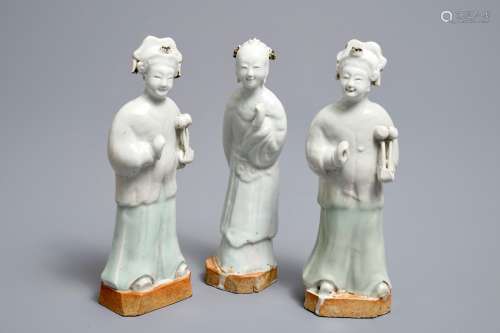 Three Chinese white- and celadon glazed biscuit figures, Qianlong