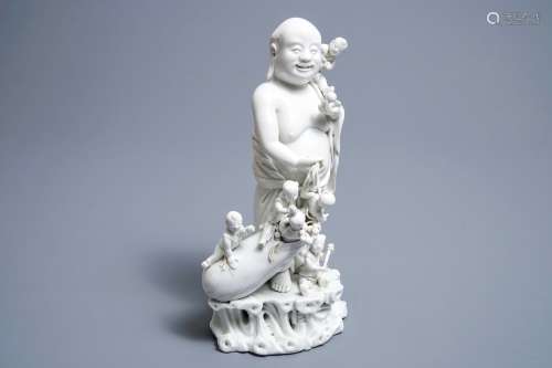 A Chinese blanc de Chine 'Buddha and playing boys' group, Kangxi