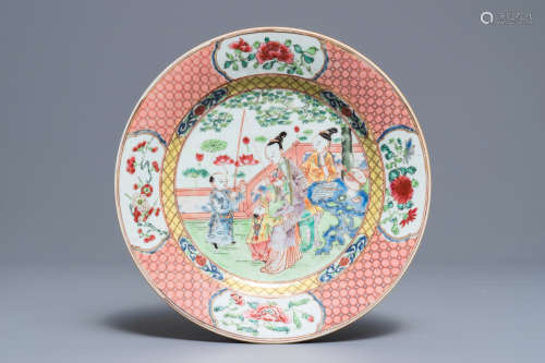 A Chinese famille rose plate with figures in a garden, Yongzheng