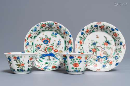 A pair of lobed Chinese famille verte cups and saucers, Kangxi