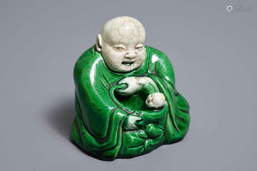 A Chinese verte biscuit model of Buddha with a child, Kangxi