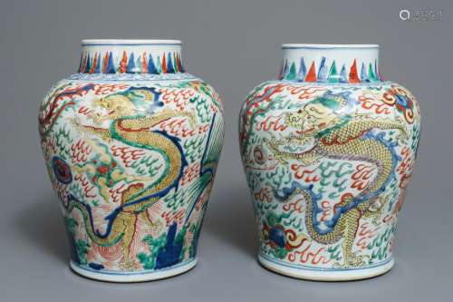 A pair of Chinese wucai ‘dragon and phoenix’ vases, Transitional period
