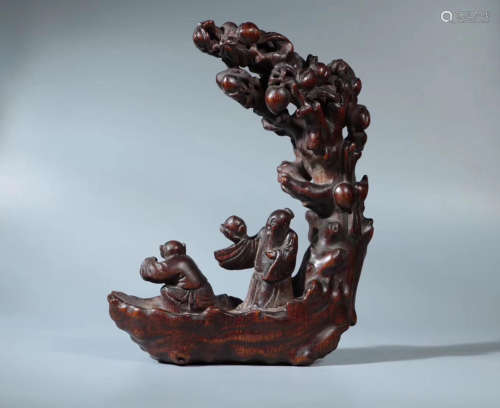 A CHENXIANG WOOD CARVED BOAT AND FIGURE ORNAMENT