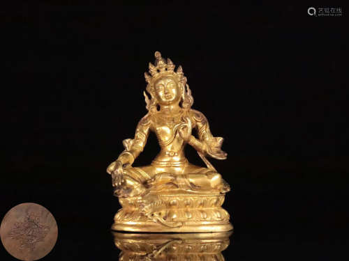 A TIBETAN GILT BRONZE BUDDHAN ORNAMENT