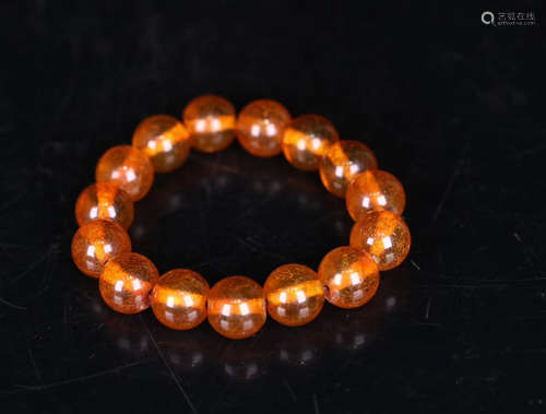 AN OLD AMBER BEAD BRACELET