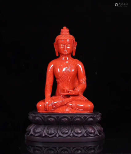 A RED CORAL CARVED PHARMACIST BUDDHA