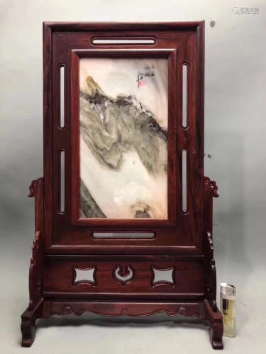 A MARBLE PANEL WITH RED WOOD FRAME