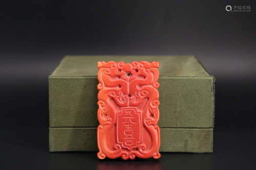 A CORAL CARVED DRAGON PATTERN PENDANT