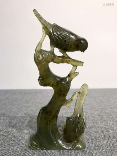 A JADE CARVED BIRD AND TREE SHAPED PENDANT