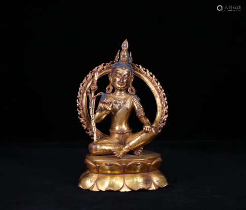 A GILT GREEN TARA BUDDHA