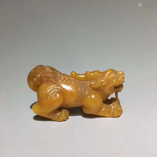 A TIANHUANG STONE CARVED BEAST SHAPED PEDANT