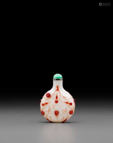 Probably Imperial, attributed to the Beijing Palace Workshops, 18th/early 19th century A red overlay decorated milky-white glass 'gourd' snuff bottle
