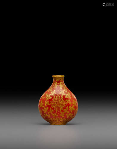 Late 18th/early 19th century A coral red and gilt decorated porcelain 'lotus' snuff bottle
