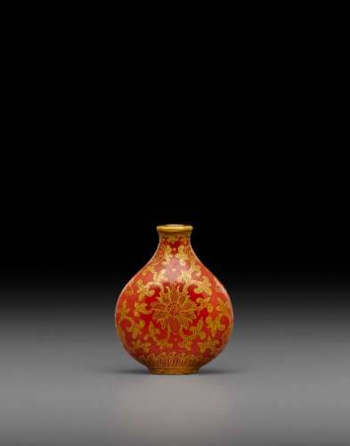 Late 18th/early 19th century A coral red and gilt decorated porcelain 'lotus' snuff bottle