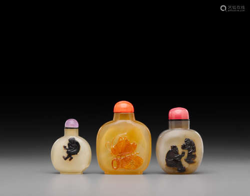 'monkey' and 'cricket' bottles: late 18th/19th century Three carved cameo agate snuff bottles