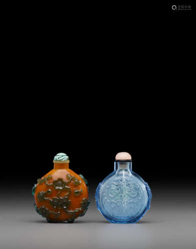 Green overly caramel bottle: 18th/19th centuryBlue bottle carved with dragons: 20th century Two glass snuff bottles