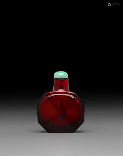 Imperial, Beijing Palace Workshops, Qianlong mark, 1736-1795 A ruby-red faceted glass snuff bottle