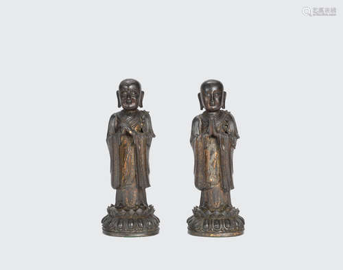 Ming dynasty A Pair of gilt-lacquered bronze figures of Ananda and Kasyapa