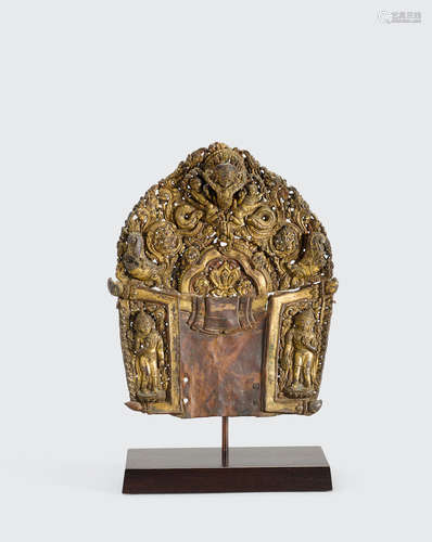 Nepal, circa 14th century A gilt copper repoussé mandorla