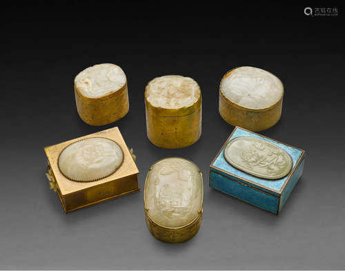 Late Qing/Republic period A group of SIX JADE PLAQUES MOUNTED TO THE COVERS OF BRASS BOXES