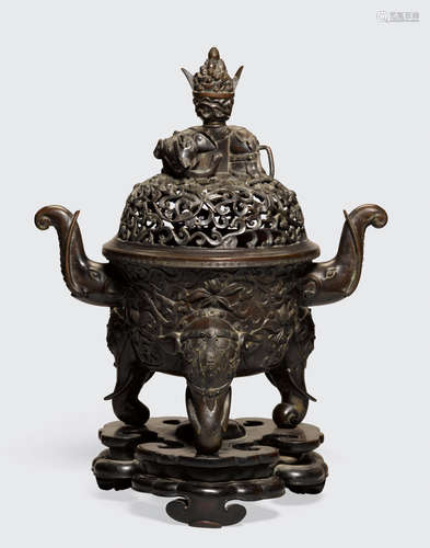 Qianlong six-character mark and of the period A large bronze tripod incense burner and cover