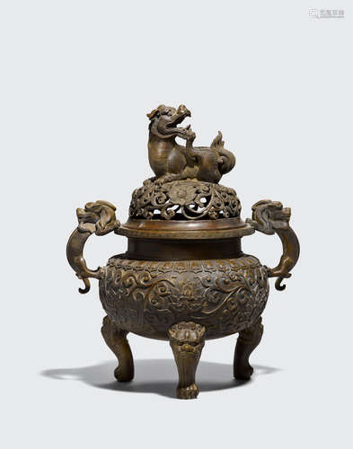 Xuande mark, 18th/19th century A cast bronze covered tripod incense burner with lion dog finial