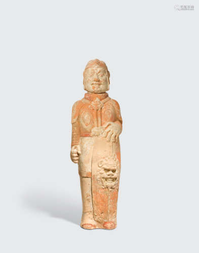 Northern dynasties, circa 500CE A PAINTED POTTERY FIGURE OF A SOLDIER