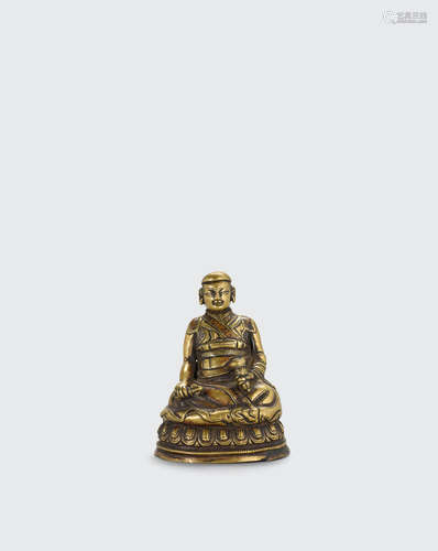 Tibet, 16th century A copper inlaid copper alloy figure of a lama