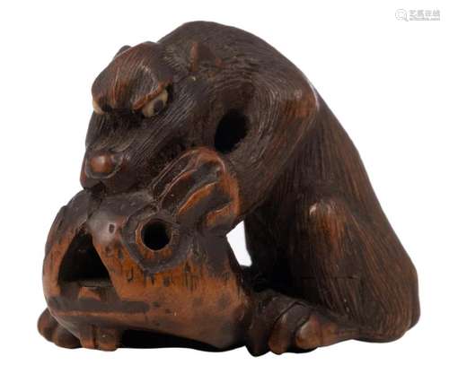 An Edo period hardwood katabori netsuke depicting a