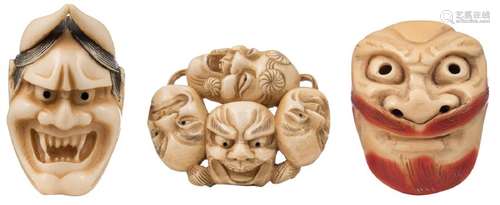 Three ivory mask netsuke, engraved, tinted; one