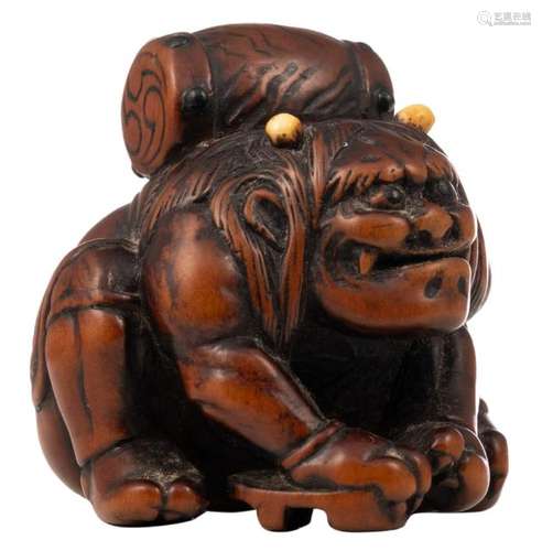 An Edo period hardwood katabori netsuke depicting an