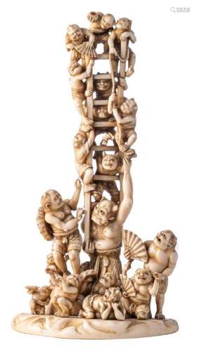 A Japanese patinated ivory sculpture, depicting a jolly