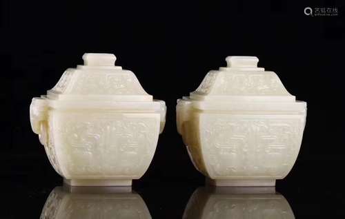 A PAIR OF CARVED JADE VASES AND COVERS