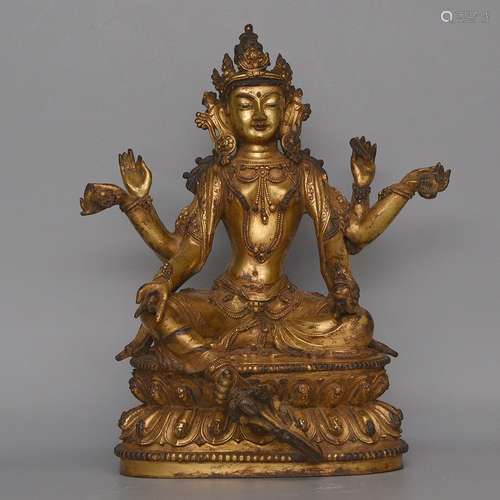 A GILT-BRONZE FIGURE OF USHNISHAVIJAYA