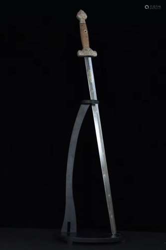 A SILVER CARVED SWORD