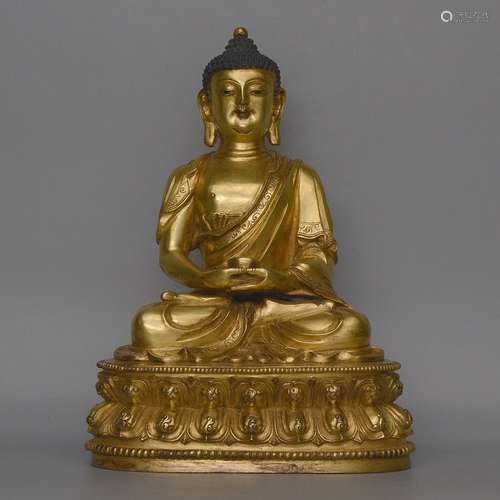 A GILT-BRONZE FIGURE OF SHAKYAMUNI