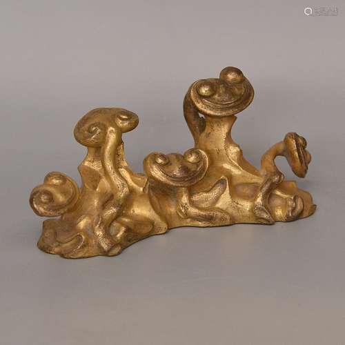 A GILT-BRONZE PAPER WEIGHT