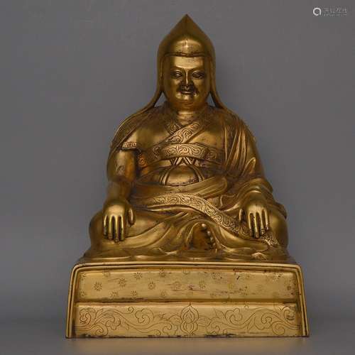 A GILT-BRONZE FIGURE OFBUDDHA