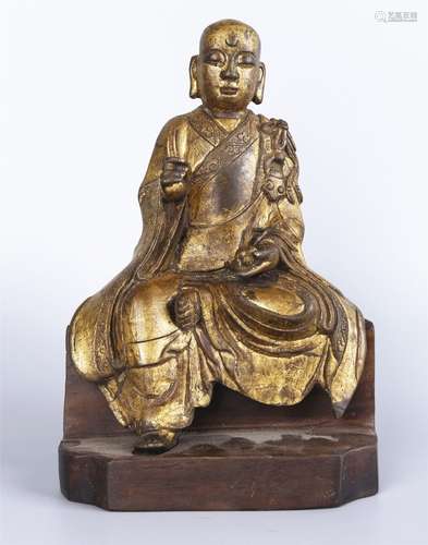 A GILT-BRONZE FIGURE OF LUOHAN