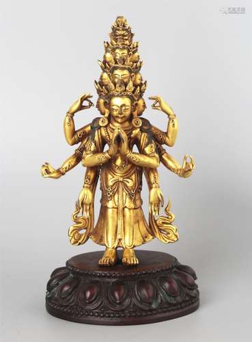 A GILT-BRONZE  AN ELEVEN-HEADED AVALOKITESHVARA