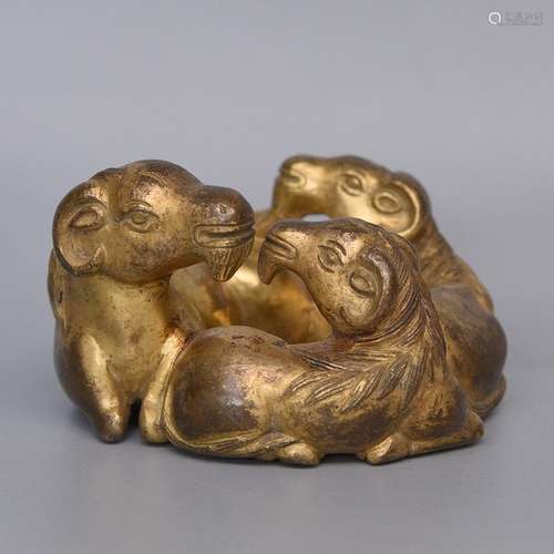 A GILT-BRONZE PAPER WEIGHT