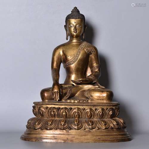 A GILT-BRONZE FIGURE OF SHAKYAMUNI