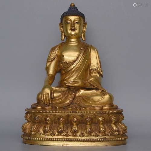 A GILT-BRONZE FIGIRE OF SHAKYAMUNI