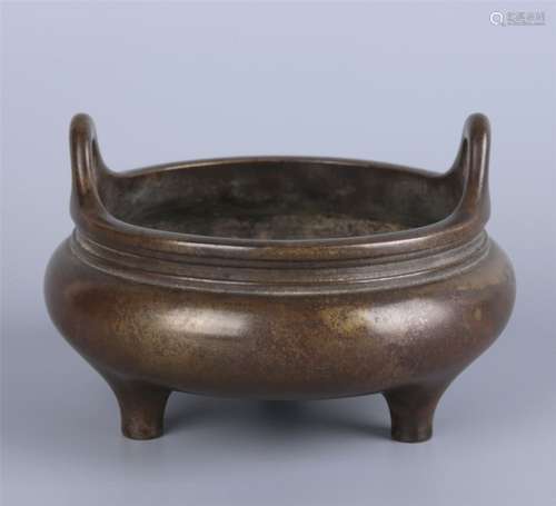 A BRONZE TRIPOD CENSER