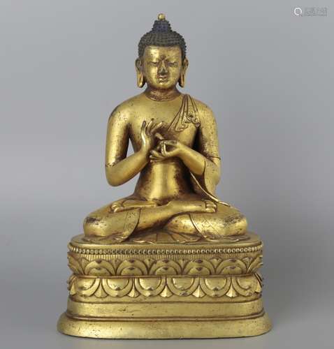 A GILT-BRONZE FIGURE OF SHAKYAMUNI