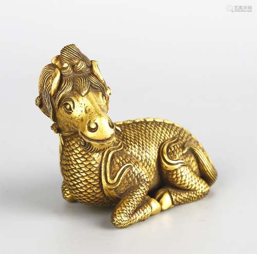 A GILT-BRONZE ORNAMENT