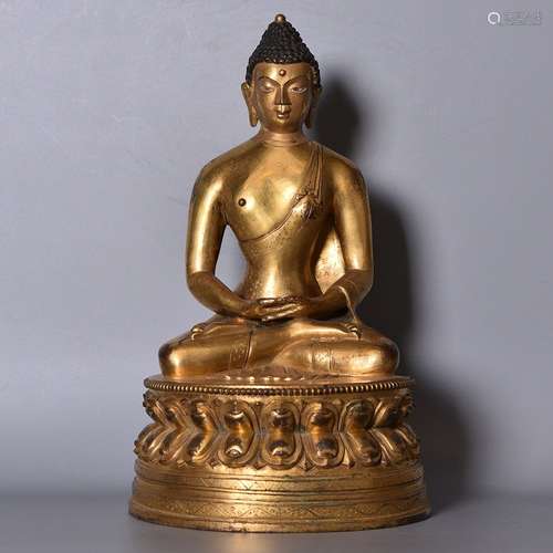 A GILT-BRONZE FIGURE OF SHAKYAMUNI